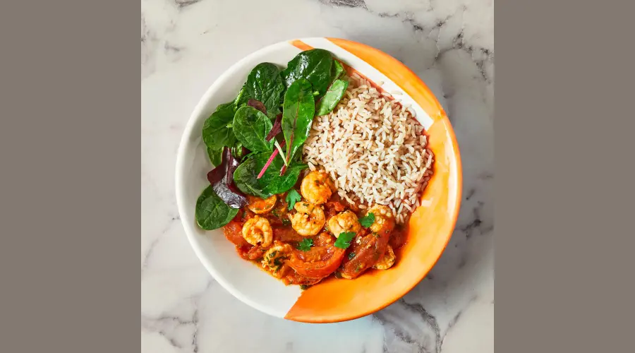 Smoky Spanish-style garlic King prawns with rice And salad